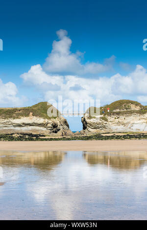 The footbridge connecting the mainland to Porth Island in Newquay in Cornwall. Stock Photo