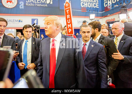 Presidential hopeful, billionaire Donald Trump, arrives with his campaign manager Corey Lewandowski in the spin room after the CNN Republican Presidential Debate at the Venetian Hotel and Casino in Las Vegas. Stock Photo