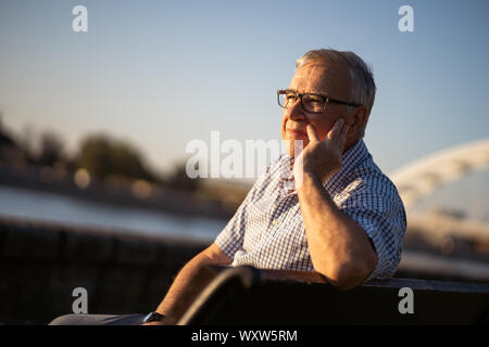 Outdoor portrait of worried and lonely senior man. Outdoor portrait of worried and lonely senior man. Stock Photo