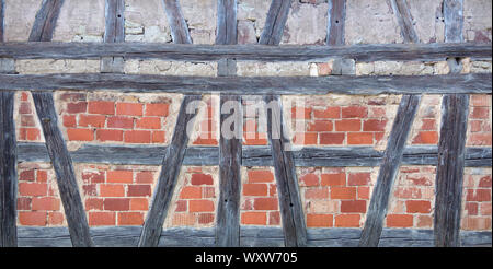 Old half-timbered with red bricks Stock Photo