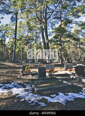 Winter in the graveyard on the island of Sandhamn in the Stockholm archipelago, Sweden Stock Photo