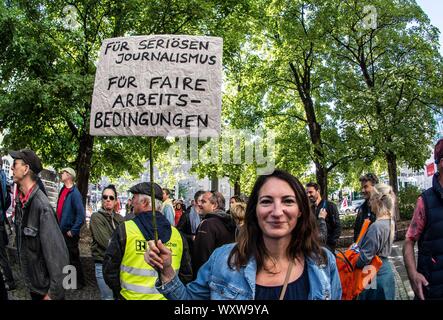 September 18, 2019, Munich, Bavaria, Germany: Demanding a raise of 6% over 12 months, along with increases of payments, licenses, and other payouts, the Bavarian Journalist Union (Bayerischer Journalisten Verband) called for a 24-hour strike against the Bayerischer Rundfunk media house in Bavaria, with the central strike at the Munich center.  The strike encompasses journalists, redaction/editorial staff, and those in related roles.  A total of 4,000 workers (3,000 employed and 1,000 freelance) are affected. (Credit Image: © Sachelle Babbar/ZUMA Wire) Stock Photo