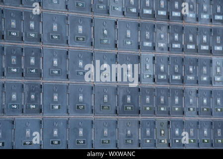 locked post boxes on an outside wall at the Ulladulla post office in New South Wales, Australia Stock Photo