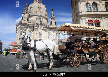 DRESDEN, GERMANY - MAY 10, 2018: Horse carriage ride at Neumarkt square in Altstadt (Old Town) district of Dresden, the 12th biggest city in Germany. Stock Photo