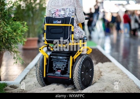 Duesseldorf, Germany. 18th Sep, 2019. The electric wheelchair in the form of a Segway 'The 2kerr Twizzler' is driven over a test track. 'The 2kerr Twizzler' is especially for big people. The fair presents possibilities to lead a largely self-determined life despite disability with the help of innovative rehabilitation technology. Around 700 exhibitors from over 40 countries will be taking part. Credit: Marcel Kusch/dpa/Alamy Live News Stock Photo