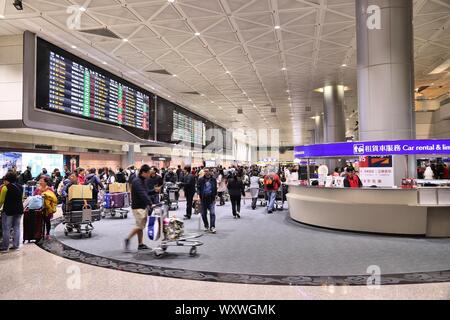 TAIPEI, TAIWAN - NOVEMBER 22, 2018: People wait at Taoyuan International Airport near Taipei, Taiwan. It is Taiwan's largest and busiest airport. Stock Photo