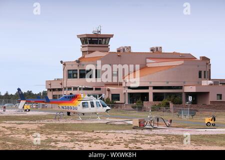 GRAND CANYON, USA - APRIL 3, 2014: Papillon Helicopters flightseeing Bell 206L in Grand Canyon National Park Airport in Arizona. 4.56 million tourists Stock Photo