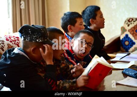 Young Chinese Tibetan children learn hard-pen calligraphy at a local ...