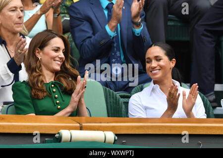 Catherine, Duchess of Cambridge, Meghan, Duchess of Sussex, Pippa Middleton in the Royal Box on Centre Court during day twelve of the Wimbledon Tennis Championships at All England Lawn Tennis and Croquet Club on July 13, 2019 in London, England. Stock Photo