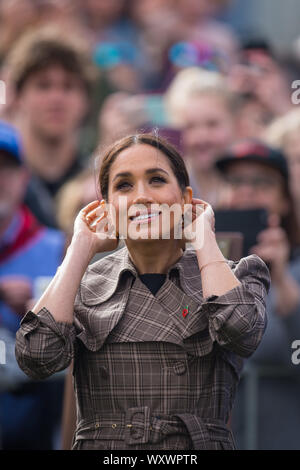 Prince Harry, Duke of Sussex and Meghan, Duchess of Sussex lay ferns and a wreath at the tomb of the Unknown Warrior while they visit the newly unveiled UK war memorial and Pukeahu National War Memorial Park on October 28, 2018, in Wellington, New Zealand. Stock Photo