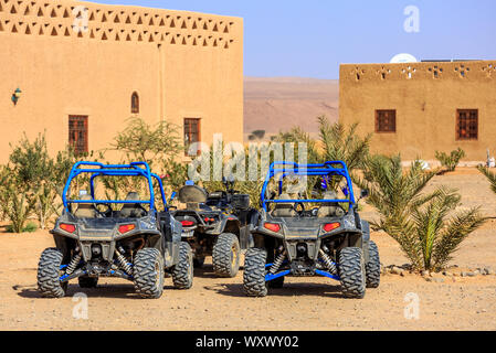 Itrane, Morocco - Feb 24, 2016: blue Polaris RZR 800 with no pilot parked in a small Berber village in Morocco desert near Merzouga Stock Photo