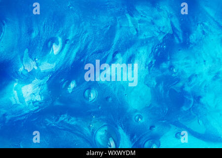 Abstract blue background with texture of slime or other liquid Stock Photo