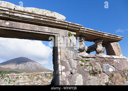 UK, Scotland, Inner Hebrides, Isle of Skye, near Broadford, Church of Kilchrist, Ruined doorway with Beinn na Caillich (mountain) beyond Stock Photo