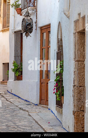 Typical street detail in small spanish village Sitges, province of Barcelona in Spain Stock Photo