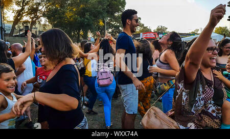 Lisbon, Portugal-CIRCA September, 2019: People of different ages dancing happily Stock Photo