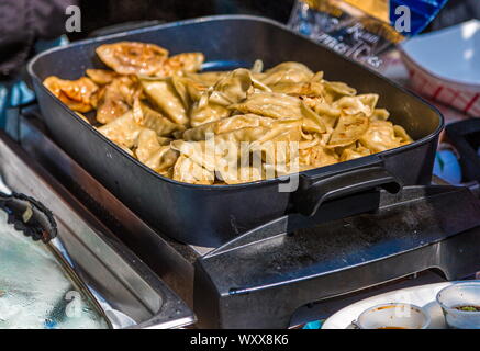 Potstickers Cooking in a Pan Stock Photo