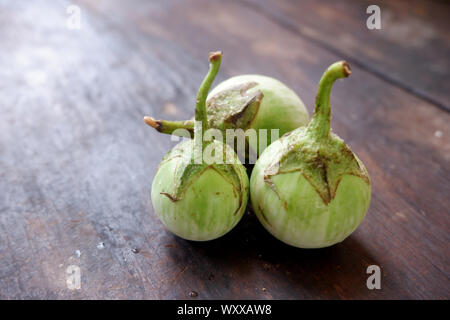 Fresh eggplant on black wood floor Stock Photo