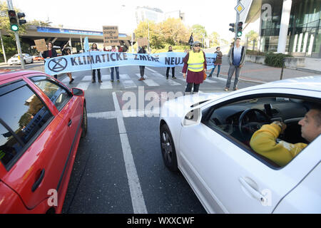 Prague, Czech Republic. 18th Sep, 2019. Some members of Extinction Rebellion group blockfor a few minutes Vyskocilova Street in Prague, Czech Republic, on September 18, 2019. The aim of the event was to highlight climate change. Credit: Ondrej Deml/CTK Photo/Alamy Live News Stock Photo