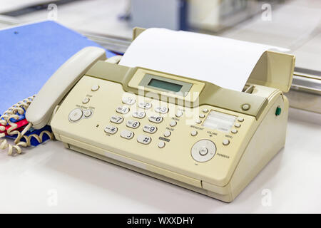 The fax machine for Sending documents in the office concept equipment needed in office Stock Photo