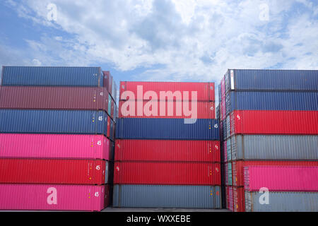 Container stack Bright sky background Stock Photo