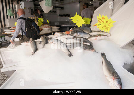 Paris, France - Aug 31, 2019: Fishmonger in n Rue Montorgueil, Market Street in Paris, France. Stock Photo