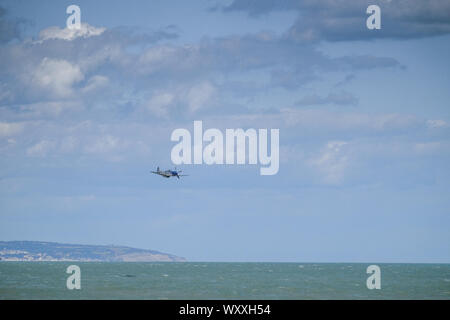 P-51 Mustang low flying over the sea. Stock Photo