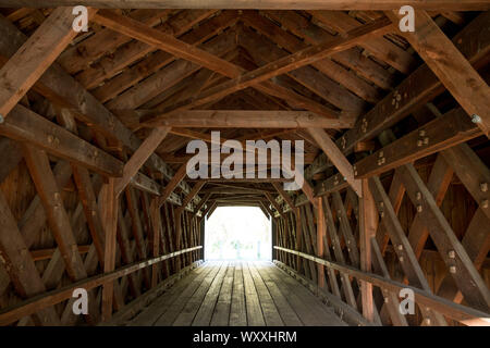 Trusses and beams in geometric shapes at The Old Covered Bridge, also known as Upper Sheffield Covered bridge by Sheffield Plain, Massachusetts. Stock Photo