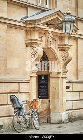 Cycle parked outside the entrance to Trinity Hall, university of Cambridge, England. Stock Photo