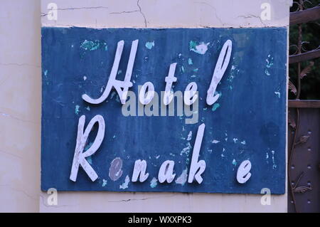 old weathered sign for the now defunct Hotel Renakse near The Royal Palace, Phnom Penh, Cambodia. credit: Kraig Lieb Stock Photo