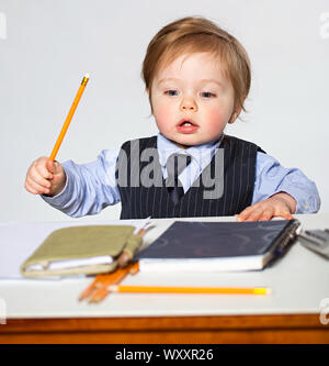 Little businessman portrait in office Stock Photo