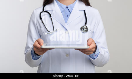 Unrecognizable Doctor Holding Tablet Standing In Studio, Panorama Stock Photo