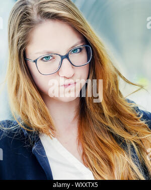 Portrait of a pensive worried businesswoman outside her office Stock Photo