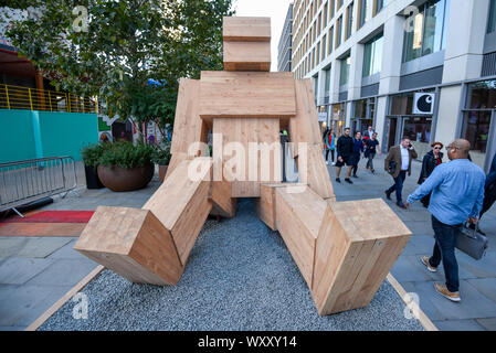 London, UK. 18 September 2019. Members of the public walk by Talk To Me  by Steuart Padwick, an interactive installation comprising two large-scale  works, standing over 5 metres high, which aims to