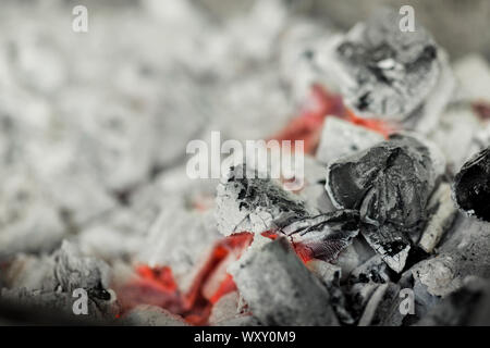 Close up of burnt black coal with red heat in brazier Stock Photo