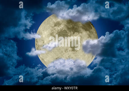 Big bright and shining full moon somewhat hidden behind clouds against a dark night sky. Fantasy illustration. Elements of this image furnished by NAS Stock Photo