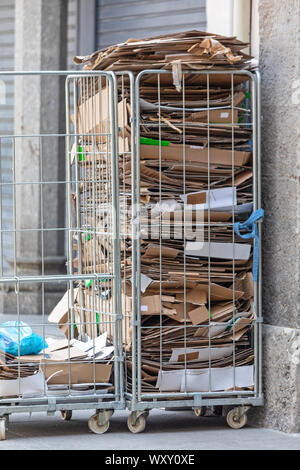 Stacked Carboard Boxes in Wire Carts Recycling Stock Photo