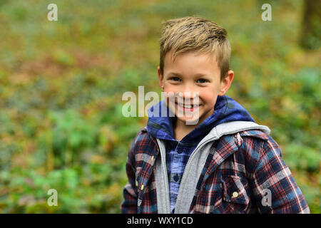 I never get tired of smiling. Little boy happy smiling outdoor. Happy little boy. Smiling child. Be positive and keep smiling Stock Photo