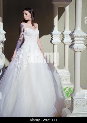 Elegant wedding salon is waiting for bride. woman is preparing for wedding. Beautiful wedding dresses in boutique. Happy bride before wedding Stock Photo