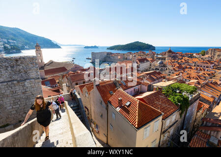 Dubrovnik city walls; tourists walking the city wall, Dubrovnik old town, Dubrovnik Croatia Europe Stock Photo