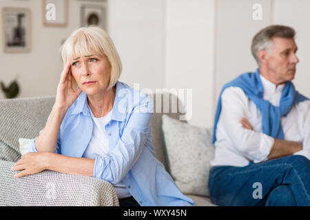 Sad senior woman after arguing with husband Stock Photo