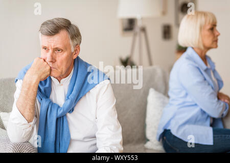 Relationship problems. Senior couple after argument sitting on sofa Stock Photo