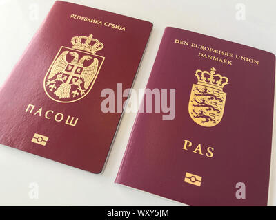 Serbian and Danish Passports on the white background Stock Photo