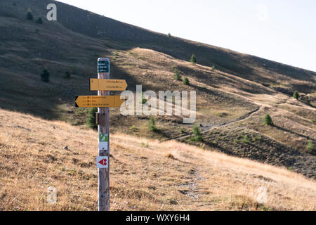direction signs on hiking trails with place names noted on them, as well as the distance from these places Stock Photo