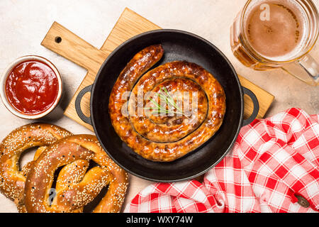 Sausage, sauerkraut, bretzels and beer. Stock Photo