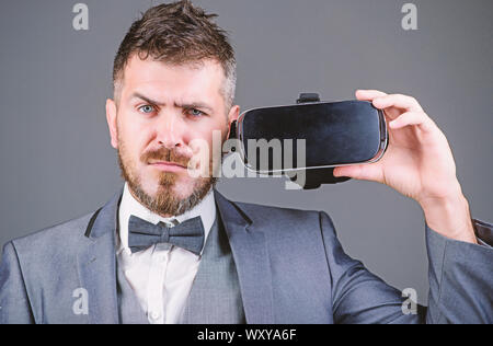 use future technology. Digital future and innovation. virtual reality goggles. Modern business. bearded man wear wireless VR glasses. businessman in VR headset. Visual reality. Using VR technologies. Stock Photo