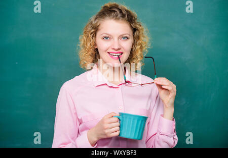 Peaceful morning. good morning. girl refreshing with tea drink. school teacher need coffee break. woman with coffee cup at blackboard. idea and inspiration. energy and vigor. energy charge. Stock Photo