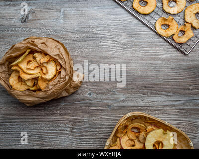 Homemade dried organic apple sliced on wood background Stock Photo