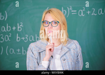 What make great teacher. Principles can make teaching more effective and more efficient. Woman teaching near chalkboard. Effective teaching involve acquiring relevant knowledge about students. Stock Photo