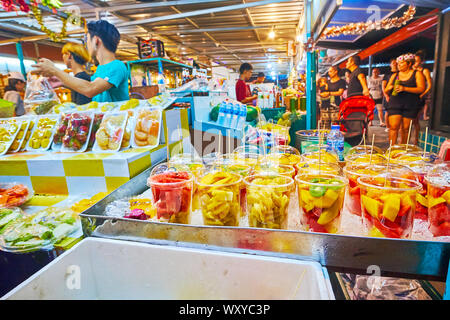 AO NANG, THAILAND - APRIL 25, 2019: Choose the tropical fruit salads or fresh cocktails in a stall of Night Market, on April 25 in Ao Nang Stock Photo