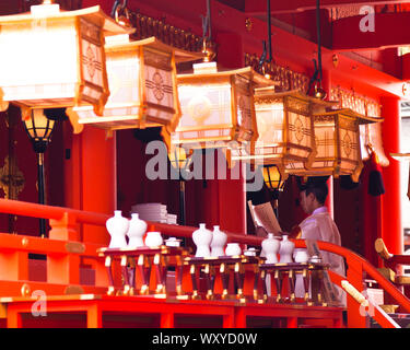 Shinto priest in the temple at Fushimi inari Stock Photo